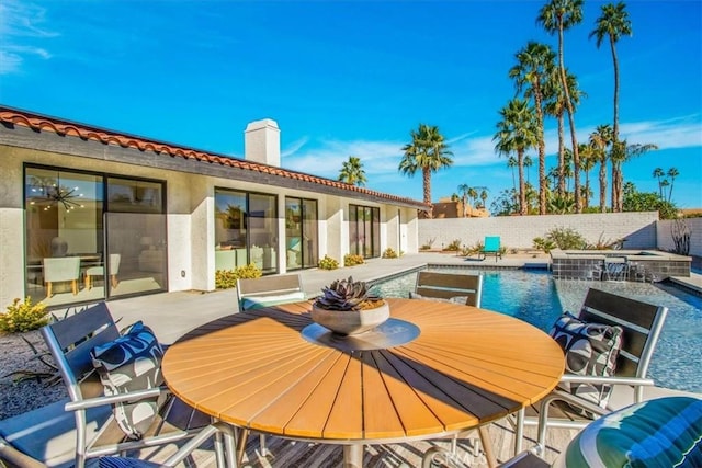 exterior space with a fenced in pool