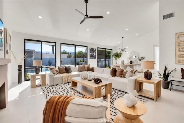 living room with lofted ceiling and ceiling fan