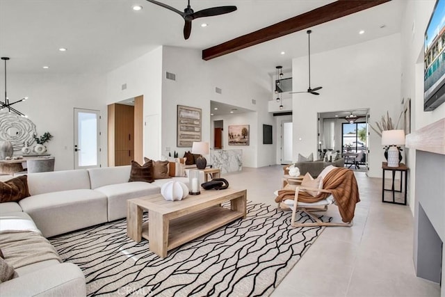 living room featuring beamed ceiling and a towering ceiling