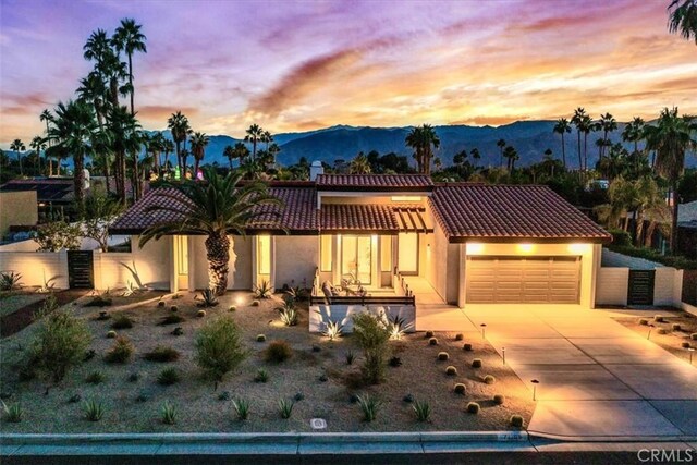 mediterranean / spanish house featuring a mountain view and a garage