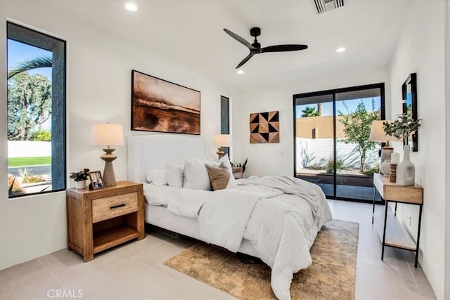 bedroom featuring multiple windows, light tile patterned floors, access to outside, and ceiling fan