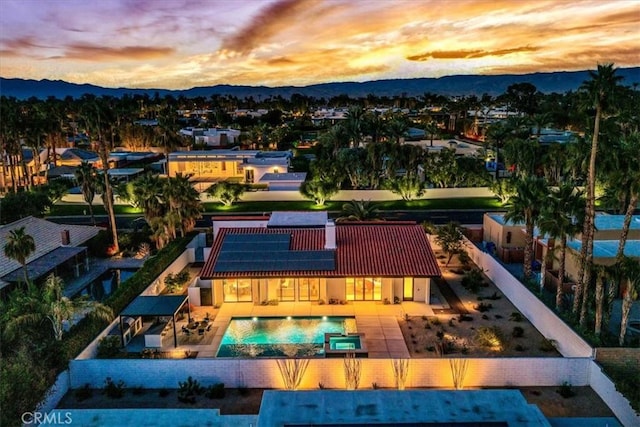 aerial view at dusk with a mountain view