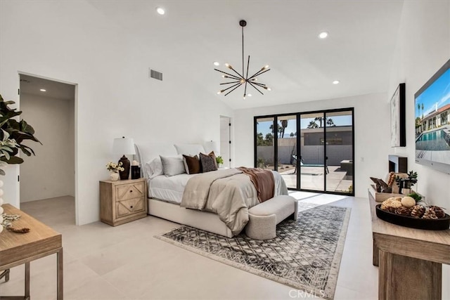 bedroom with a high ceiling, access to exterior, and a chandelier