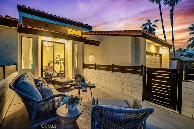 view of patio terrace at dusk