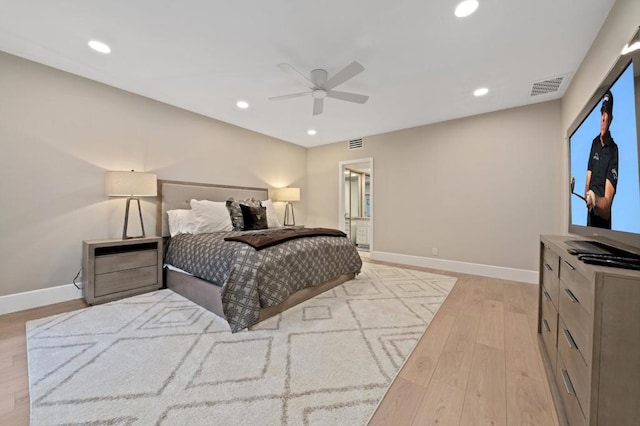 bedroom featuring light hardwood / wood-style floors and ceiling fan