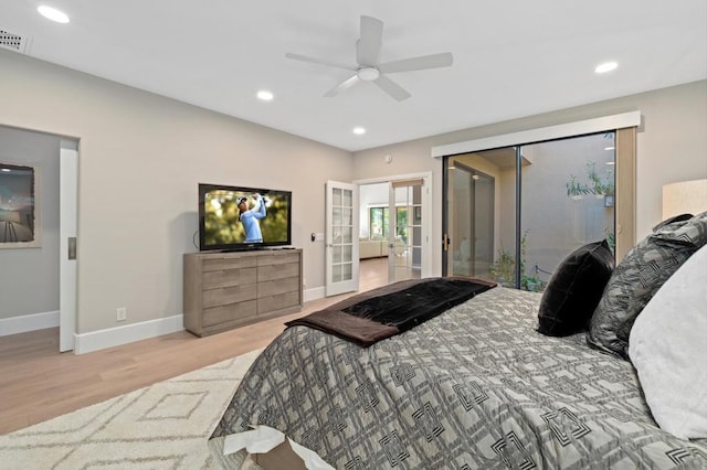 bedroom featuring ensuite bath, ceiling fan, french doors, light hardwood / wood-style floors, and access to outside