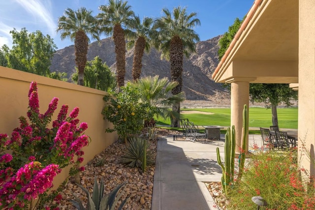 exterior space with a patio area and a mountain view