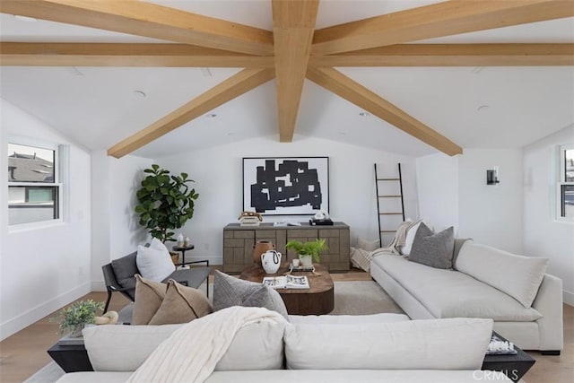 living room with lofted ceiling with beams and light wood-type flooring