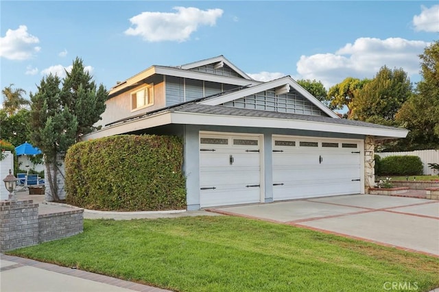 view of home's exterior featuring a garage and a lawn