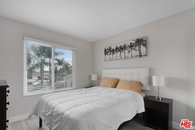 bedroom with light hardwood / wood-style floors