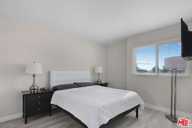 bedroom with light hardwood / wood-style flooring