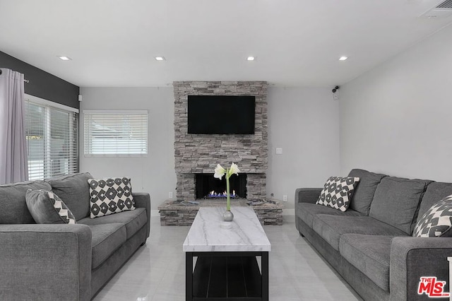 living room featuring a fireplace