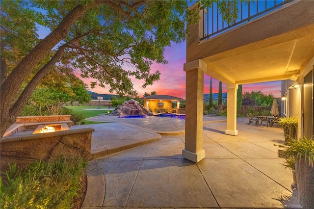 patio terrace at dusk with a fire pit