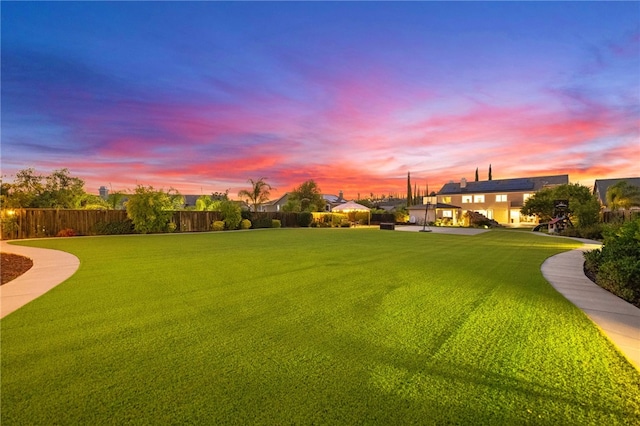 view of yard at dusk