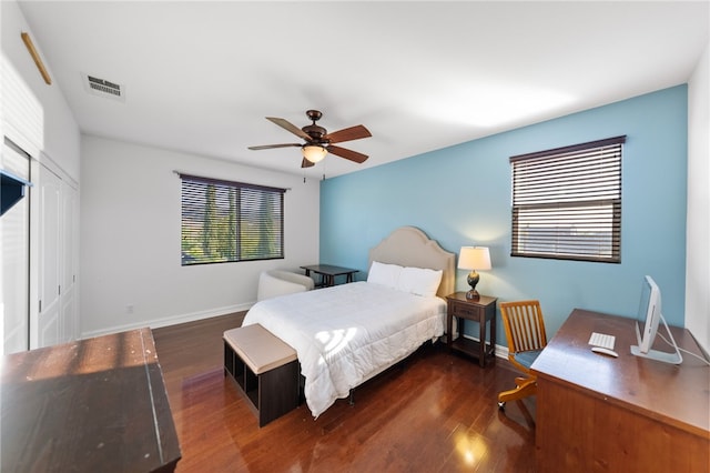 bedroom featuring ceiling fan and dark wood-type flooring