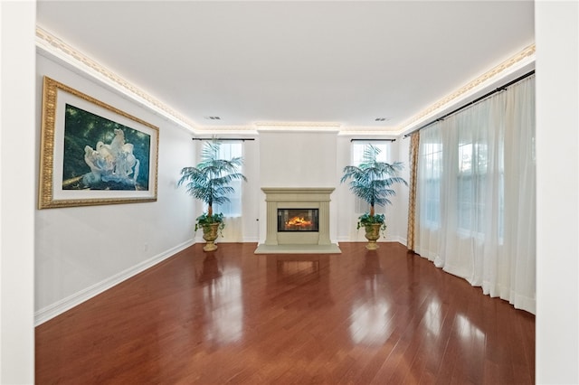 unfurnished living room with wood-type flooring and a healthy amount of sunlight