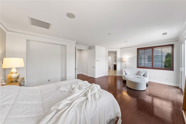 bedroom featuring ornamental molding and dark wood-type flooring