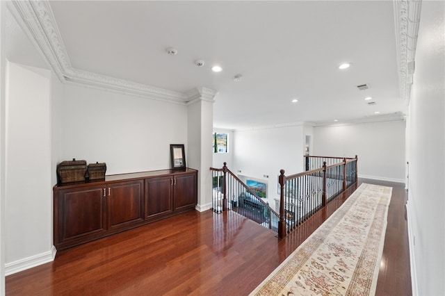 corridor featuring crown molding and dark wood-type flooring