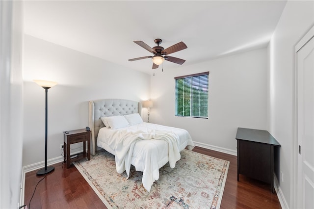 bedroom featuring ceiling fan and dark hardwood / wood-style floors