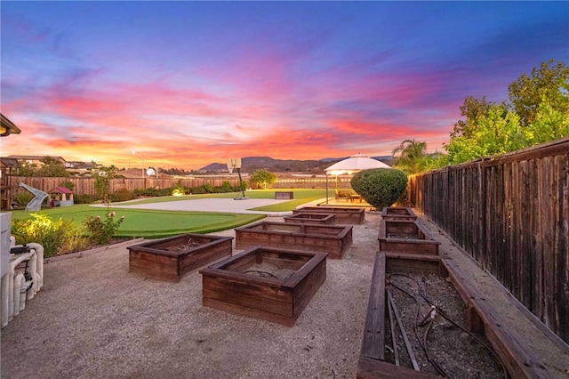 view of patio terrace at dusk