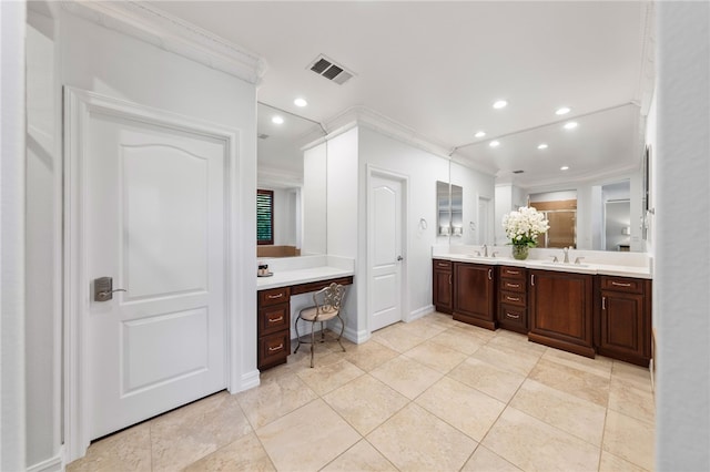 bathroom featuring tile patterned floors, vanity, and ornamental molding