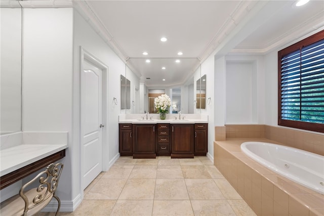 bathroom featuring tile patterned flooring, vanity, tiled bath, and ornamental molding