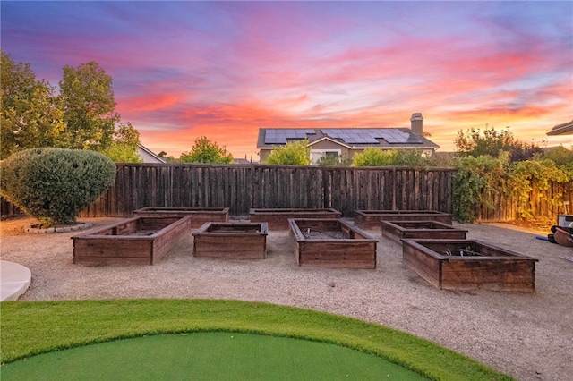 view of patio terrace at dusk