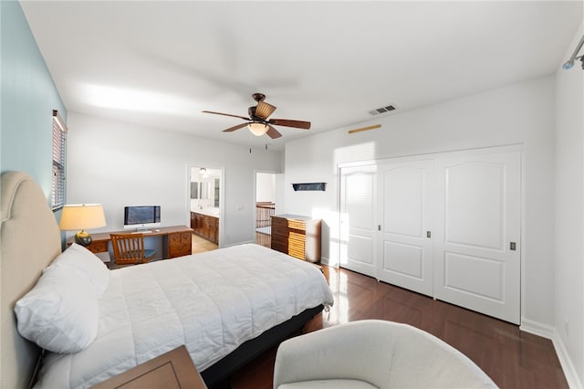 bedroom with connected bathroom, ceiling fan, a closet, and dark hardwood / wood-style floors