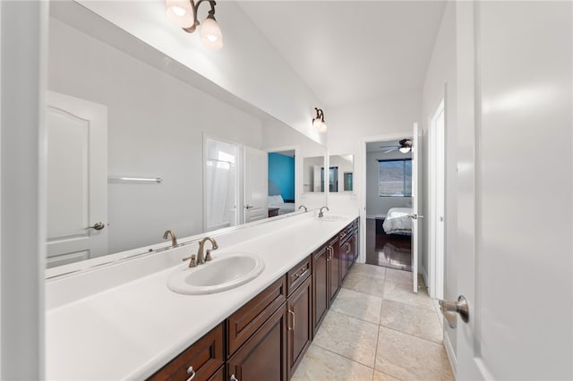 bathroom featuring tile patterned flooring, vanity, ceiling fan, and a healthy amount of sunlight