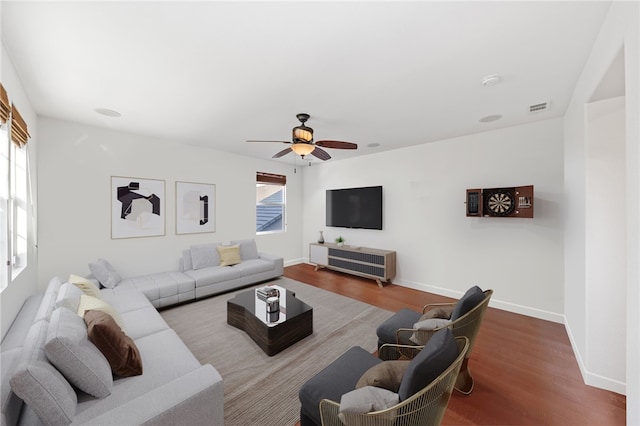 living room with ceiling fan and wood-type flooring