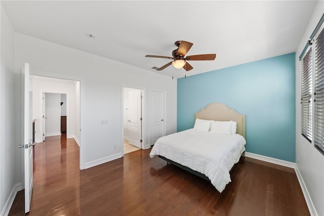 bedroom with ceiling fan and dark hardwood / wood-style floors