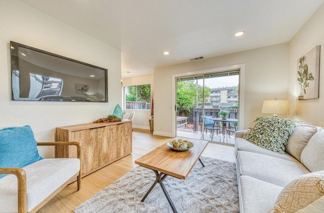 living room with light hardwood / wood-style floors