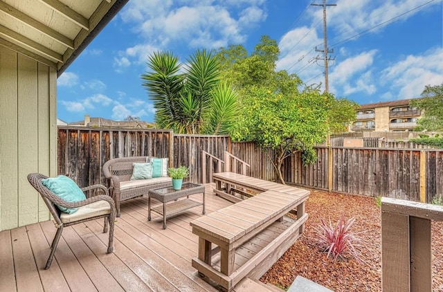 wooden deck with outdoor lounge area