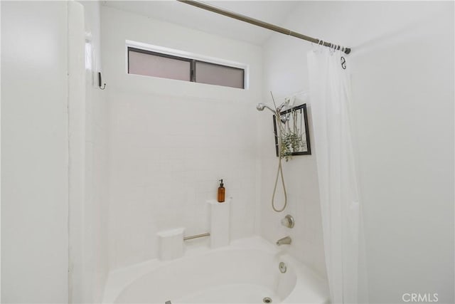 bathroom featuring shower / bath combination with curtain