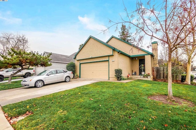 view of front of property with a garage and a front lawn