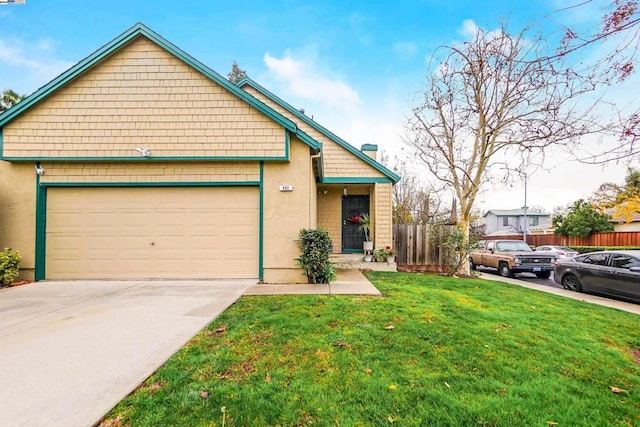 view of front of property with a garage and a front yard