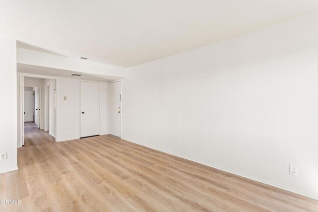 unfurnished room featuring light wood-type flooring