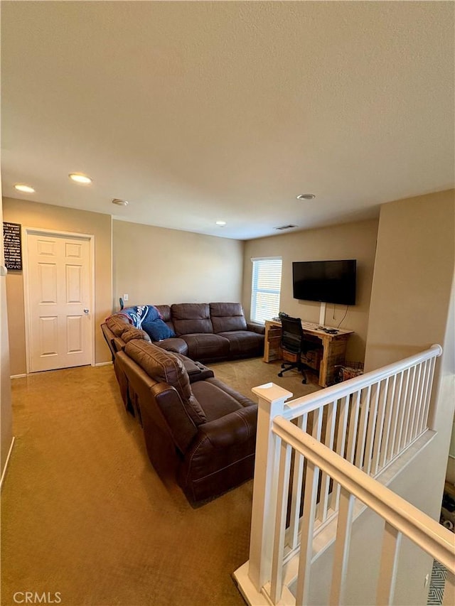 carpeted living area featuring recessed lighting