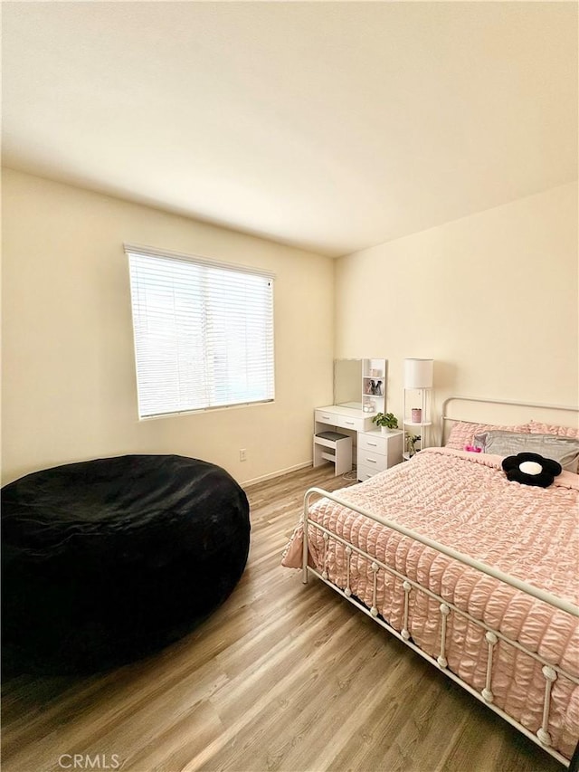 bedroom featuring light wood-style flooring