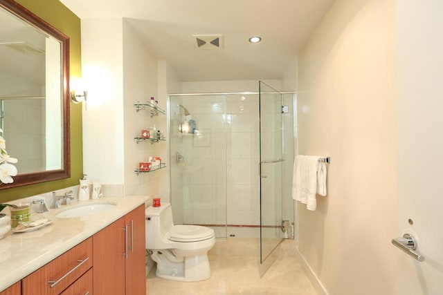 bathroom featuring vanity, toilet, tile patterned floors, and a shower with door