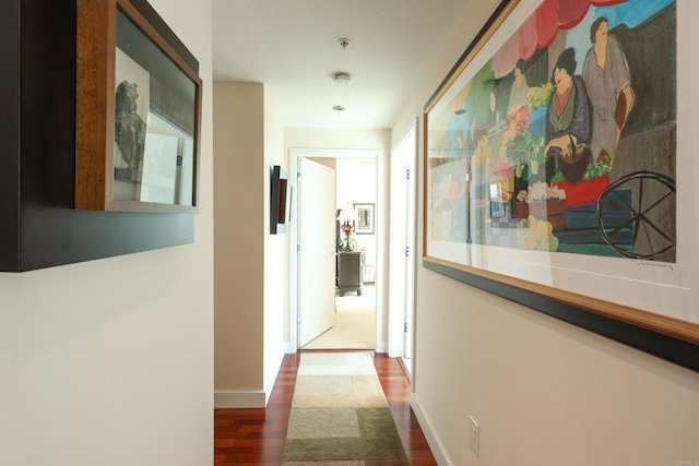 hallway with dark wood-type flooring