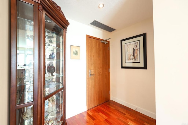 corridor with dark wood-type flooring