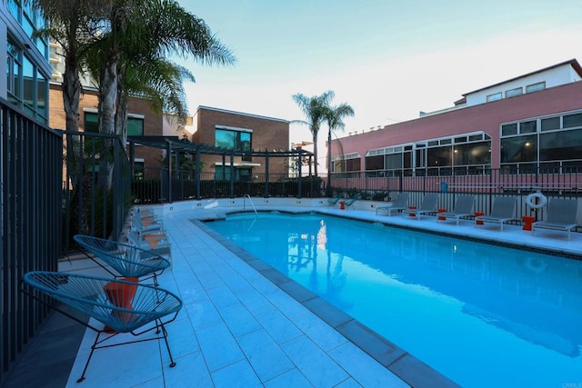 view of swimming pool with a pergola