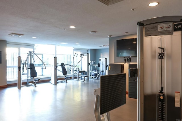 workout area featuring a wall of windows