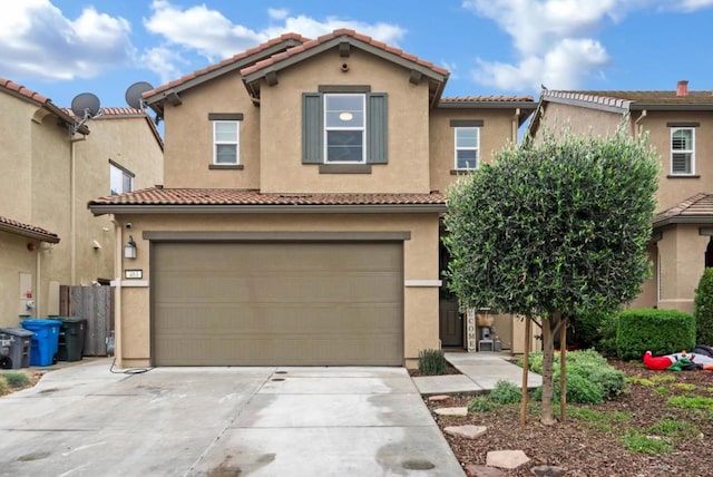 mediterranean / spanish-style house featuring a garage