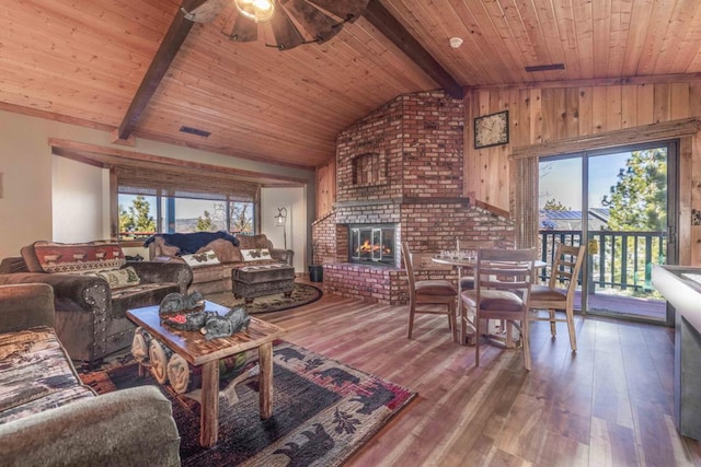 living room featuring wooden ceiling, vaulted ceiling with beams, and hardwood / wood-style flooring