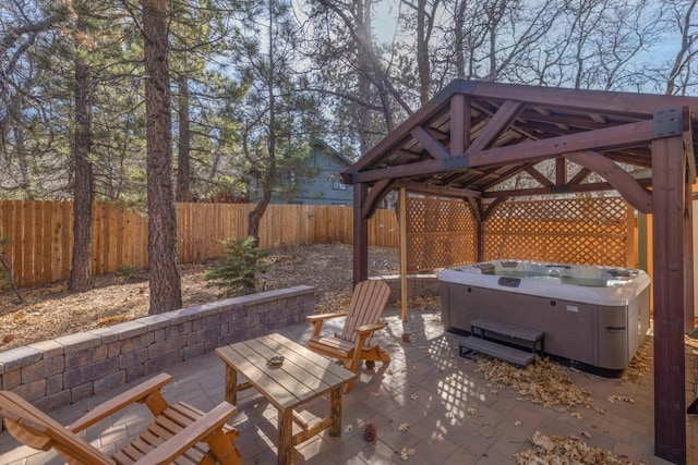 view of patio with a gazebo and a hot tub