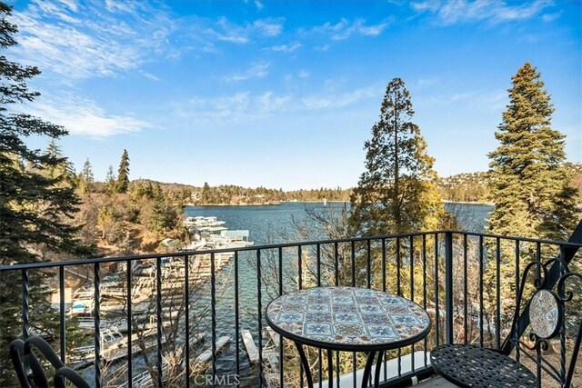 balcony featuring a water view