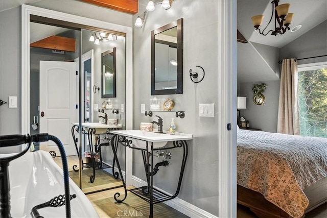 28906 Palisades Dr, Lake Arrowhead, CA 92352 - full bath with connected bathroom, wood finished floors, baseboards, lofted ceiling, and a chandelier