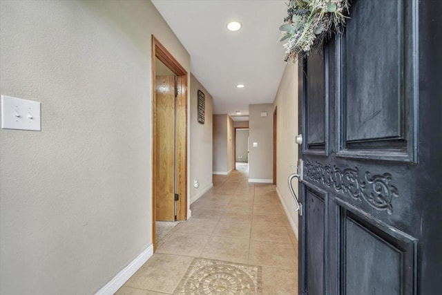 hallway featuring light tile patterned floors